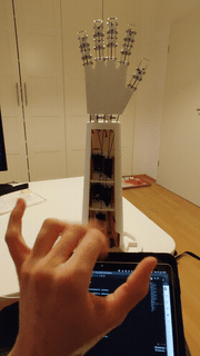 Looping clip of the robotic hand mirroring a human hand's finger movements in real time.